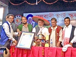 Artiste Dulal Roy receiving 'Jivan Silpi' award in Nalbari on