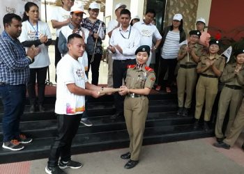 Leader of cyclists team from Kohima Shikato Aye handing over the cyclothon baton to the leader of cyclists team from Dimapur Asenla Imsong in Dimapur on Tuesday evening. Pic by Bhadra Gogoi