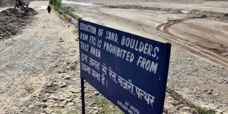 a-board-says-extraction-of-sand-boulders-prohibited