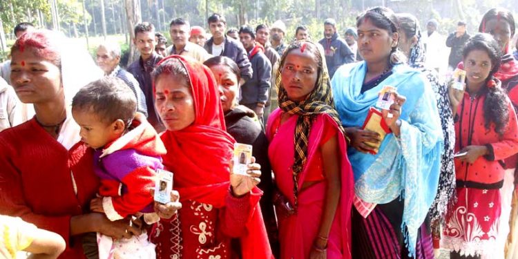 Voters stand in queues to cast their votes during the RE voteing first phase of Assam panchayat election polling at Kharikotiya Kishan LP School, Mariani on 06-12-18.Pix by UB Photos