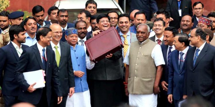 Interim Finance Minister Piyush Goyal along with minister of state Shiv Pratap Shukla and Pon Radhakrishnan, and the team of officials coming out of north block office on way to Parliament House to Present the Interim Budget in New Delhi on Friday. The Print Picture by Suraj Singh Bisht 01 feb 2019.