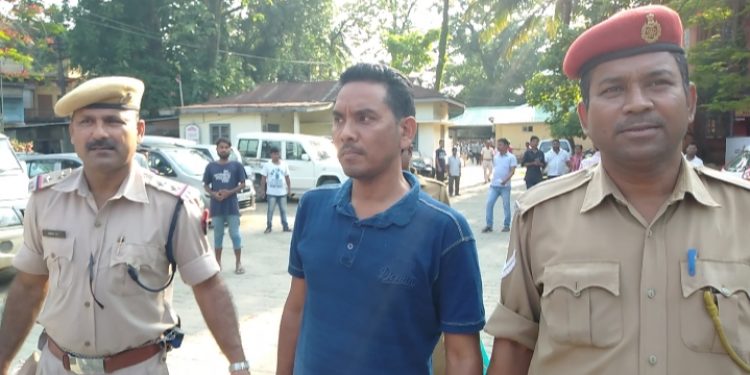 Cashier-cum-Head-Assistant-of-SMCH-Bidyut-Barman-being-produced-in-CJM-court-in-Silchar-on-Thursday