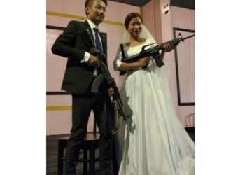Bride-Groom-with-Guns-at-hand-750x375
