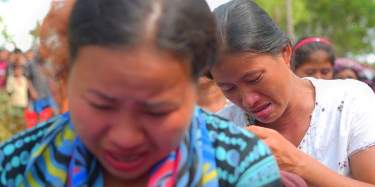 Bru migrants weep amidst a roads blockade protest at Dasda-Anandabzaaar area in North Tripura on Sunday while describing their plight in relief camps.