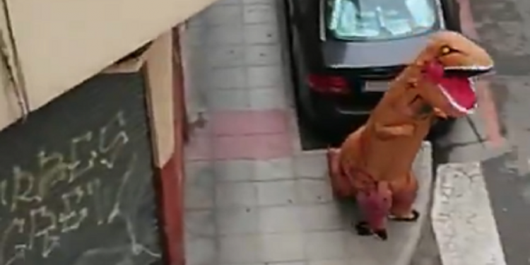 Amid Coronavirus lockdown, man in Spain leaves house wearing dinosaur costume