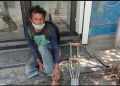 Lockdown: Assam on duty policemen provide food to a beggar in Guwahati's Bharalumukh