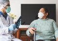 Latin American Doctor Checking Patient Infected of Covid-19 at Home.