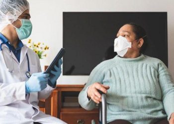 Latin American Doctor Checking Patient Infected of Covid-19 at Home.