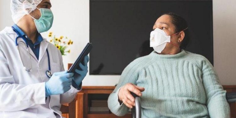 Latin American Doctor Checking Patient Infected of Covid-19 at Home.