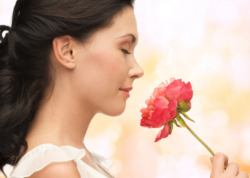 woman-smelling-a-rose