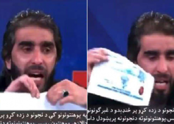 Afghan professor tears diploma certificate
