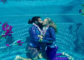 Couple kisses under water