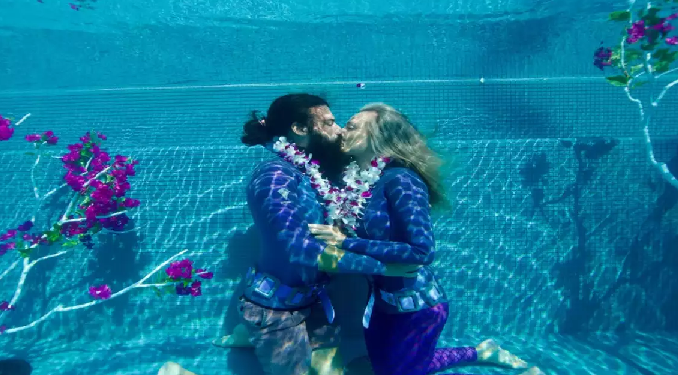 Couple kisses under water