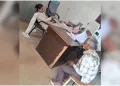 অহংকাৰী মহিলা আৰক্ষীৰ কৰ্মকাণ্ড: মেজৰ ওপৰত ভৰি তুলি বৃদ্ধক অৱজ্ঞা, চাকৰিৰ পৰা নিলম্বিত